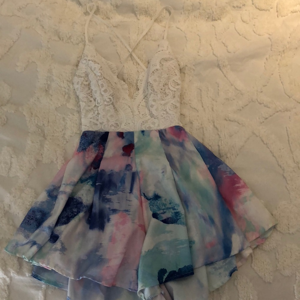 White and multi colored romper